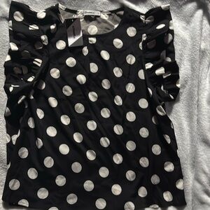 Casual women’s polkadot top with ruffles